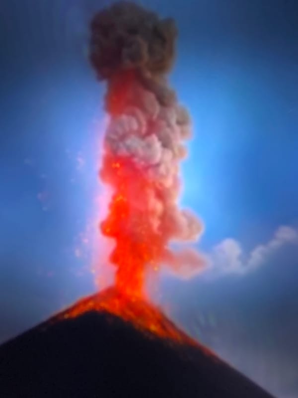 Active volcano erupts with glowing lava flows down its slopes