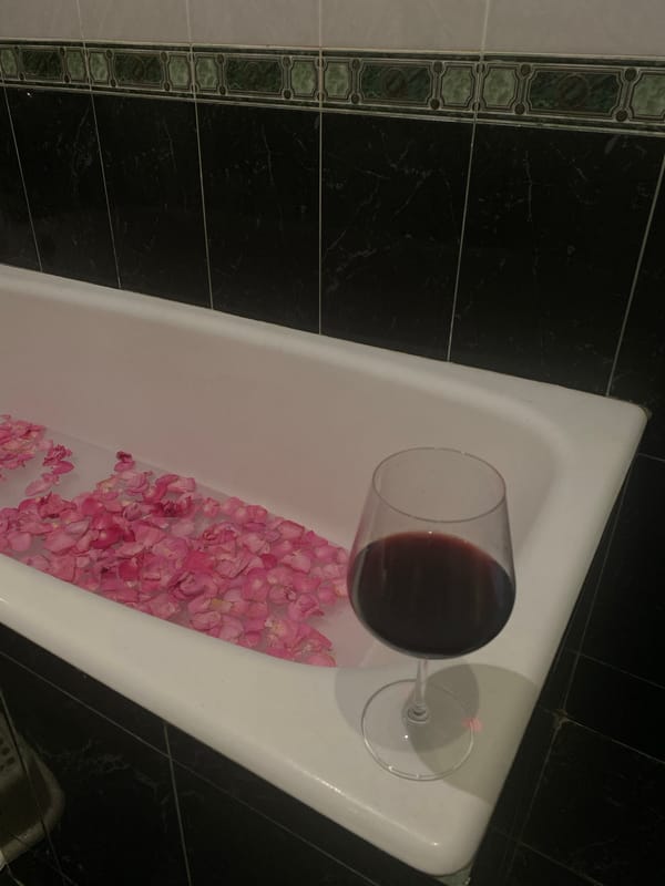 Rose petal bath with wine documented in Sochi bathroom