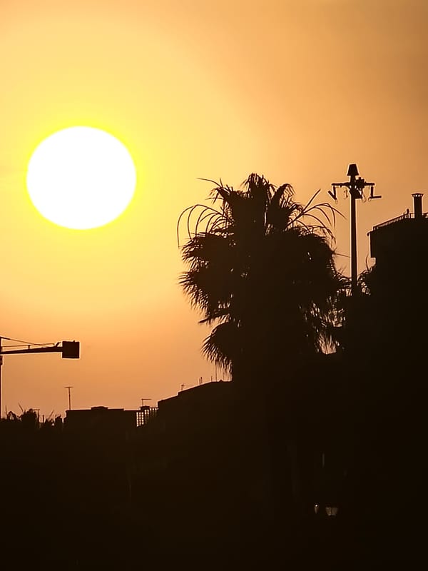 Sunset observed over Quarteira beach, Portugal during evening hours