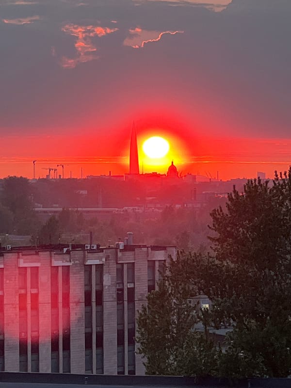 Vibrant red sunset observed over Saint Petersburg cityscape