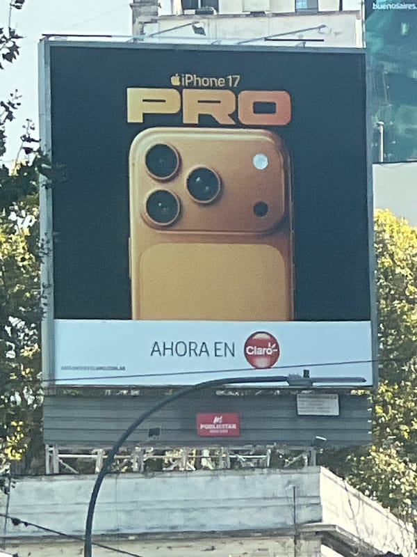 Buenos Aires street scenes: iPhone billboard, car maintenance, delivery driver