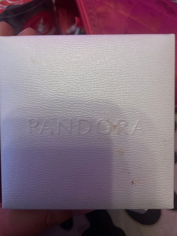 Pandora jewelry boxes photographed on bedside table in Russia