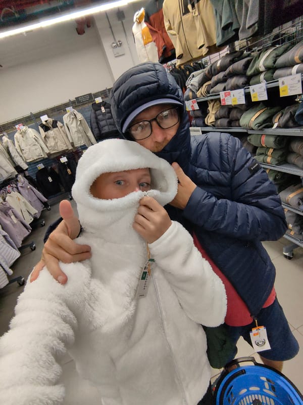 Adult and child share moment during clothing shopping in Hanoi