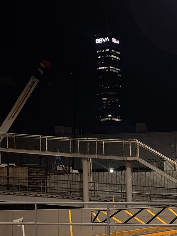 BBVA building illuminated during nighttime construction in Mexico