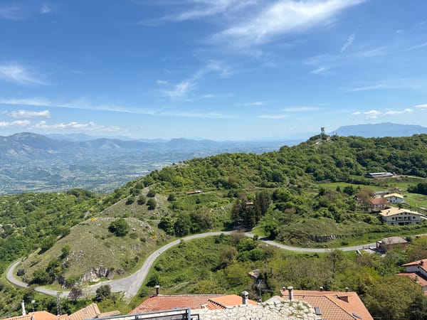 Tourist captures scenic views and dinosaur sculptures in Italian hilltown