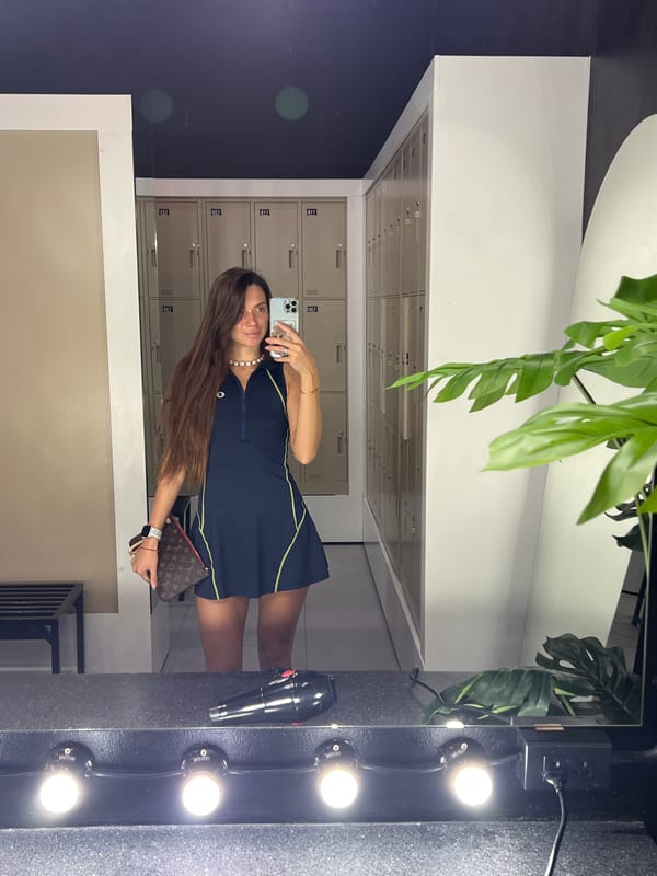 Locker room mirror selfie in a blue and yellow outfit