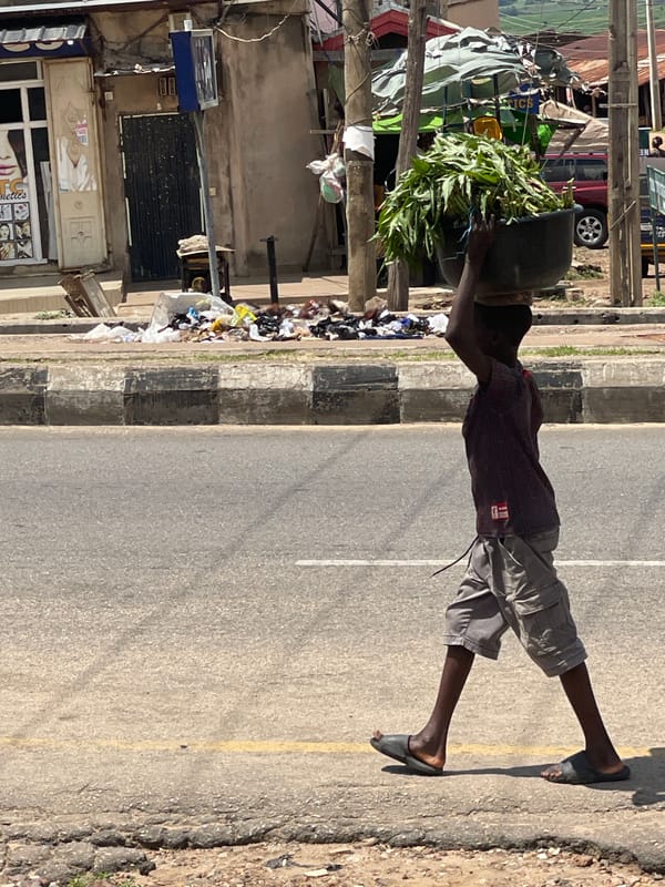 A West African street in full swing on a Tuesday morning