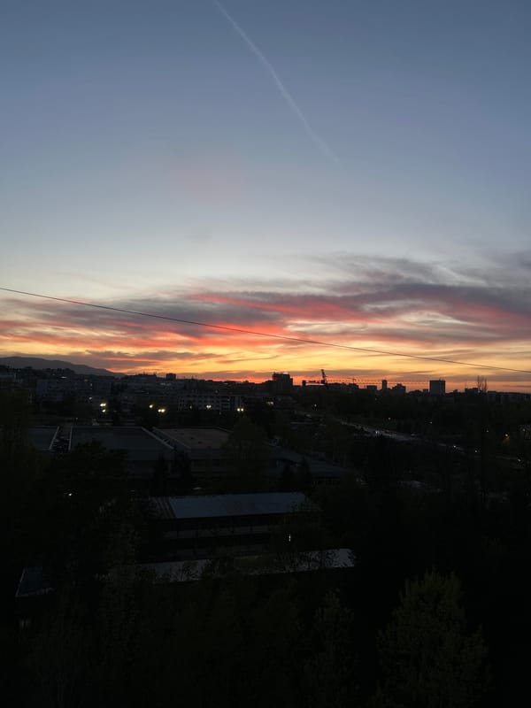 Dramatic sunset displays vivid colors over Sofia skyline