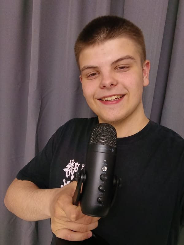 Young man takes microphone selfies during snowy night in Andreyevo