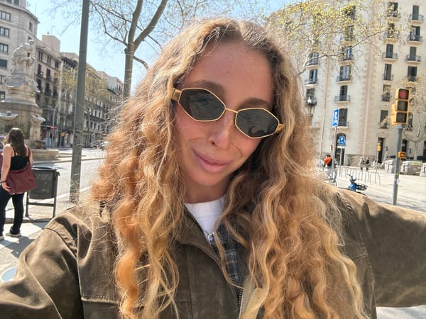 Tourist takes selfies near Hotel Majestic on Barcelona's Passeig de Gràcia