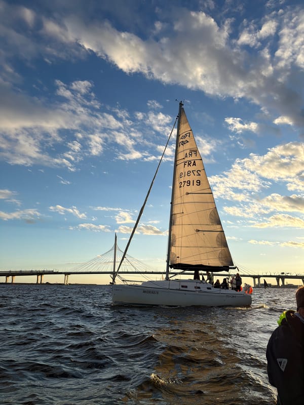 Sailing regatta on Saint Petersburg's waterways at golden hour