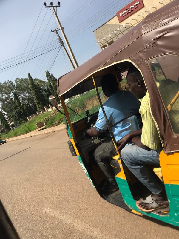 Auto-rickshaw journey documented through Nigerian neighborhoods during morning commute