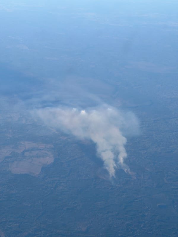 White smoke plume spotted over rural Saint Petersburg landscape