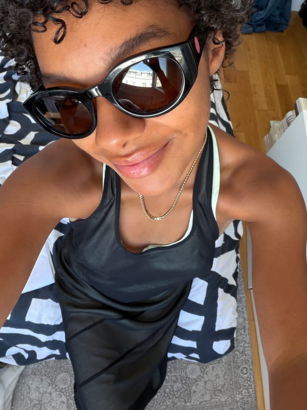 Selfie series in Paris, cat-eye shades on a patterned bed