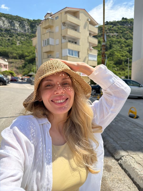 Tourist takes selfies on sunny morning in Budva Montenegro
