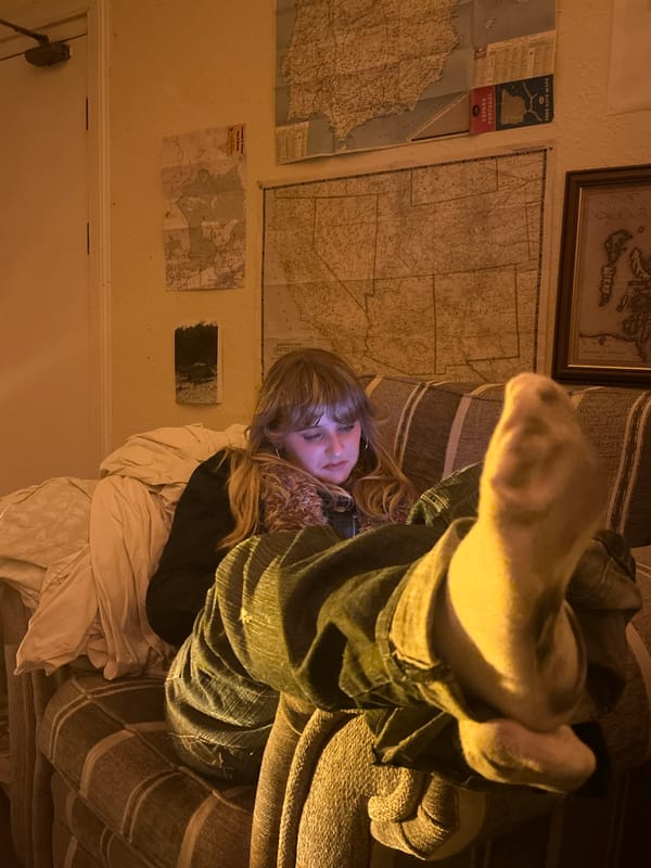 Person relaxing at home during nighttime hours in Dundee