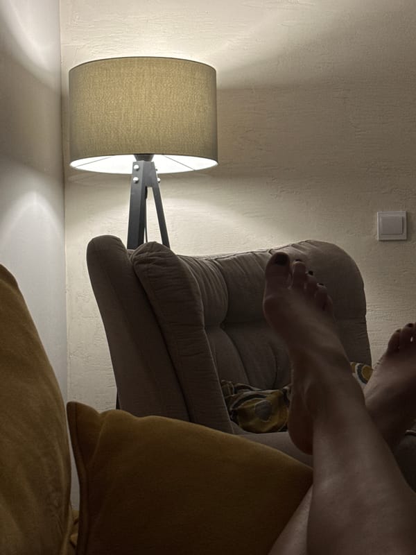 Person relaxes in armchair during evening in Podgorica