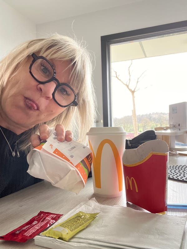 Woman enjoys McDonald's Big Mac meal in French town
