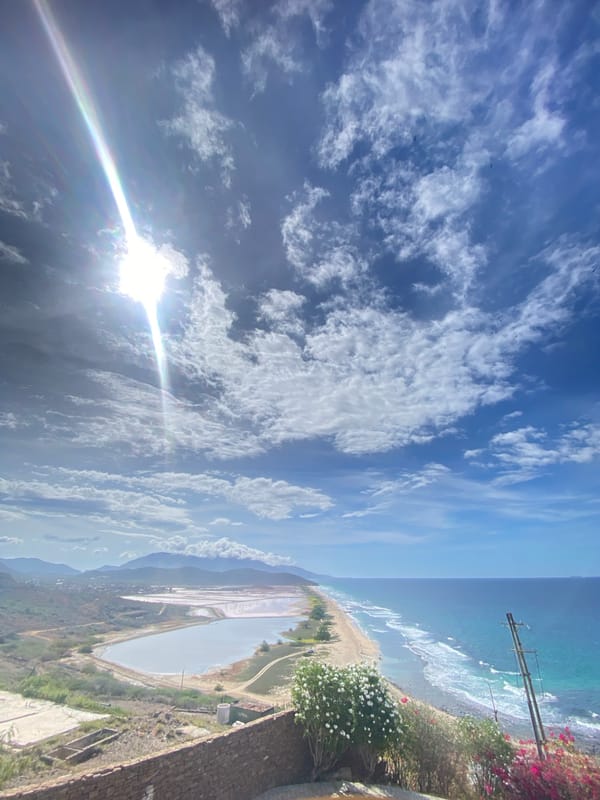 Pampatar lighthouse and coastline on a sunny afternoon
