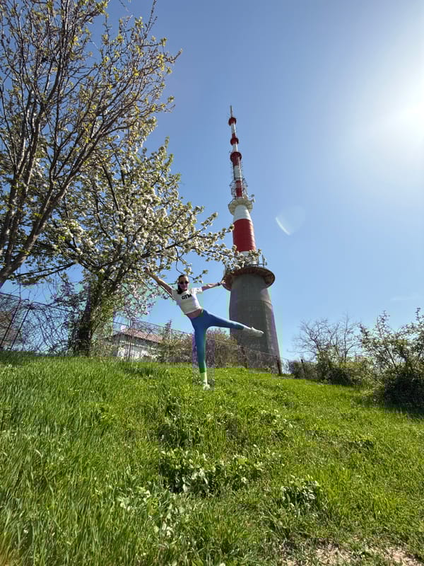Woman performs outdoor exercise pose in Pleven park