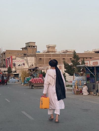 Roadside fruit vendors conduct daily business in Kandahar