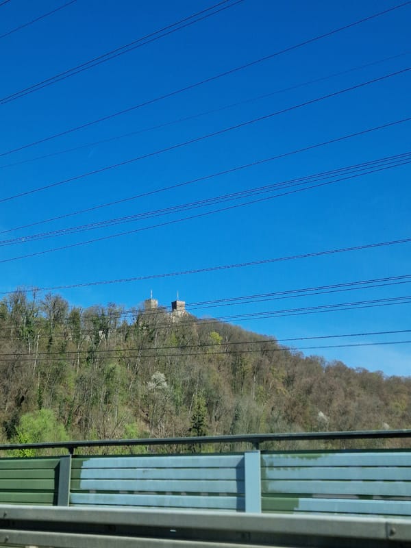 Power lines documented against blue sky in Lörrach, Germany