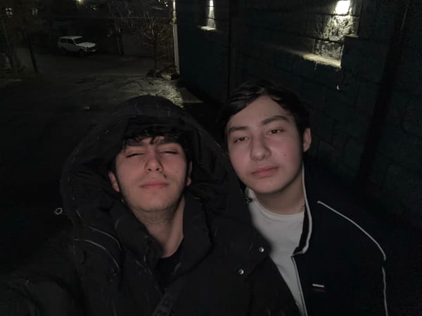 Young men photograph themselves on Yerevan streets