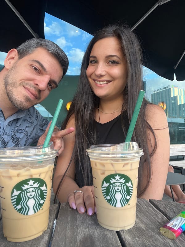 Iced Starbucks drinks and a Guess bag at a Sofia patio