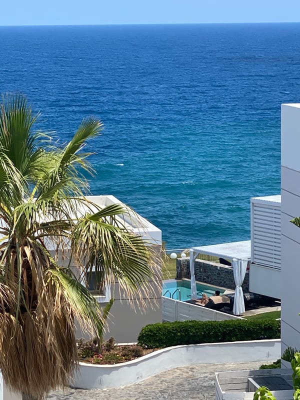 Balcony views and blooms overlooking the Aegean in Panormos