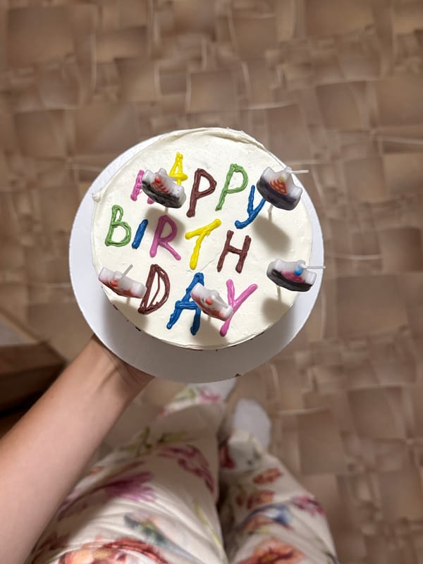 Birthday celebration captured in Belgorod with decorated cake and balloons