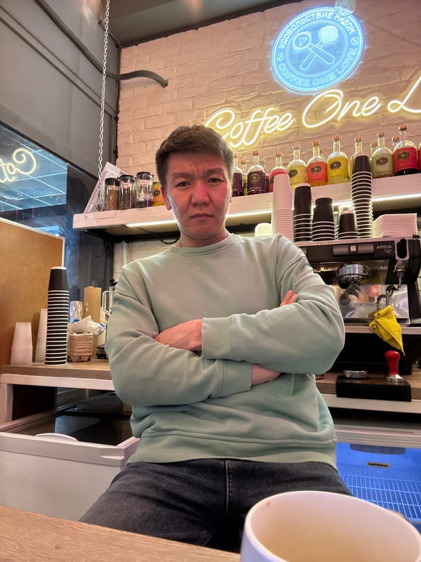 Customer waits at coffee shop counter in Dolgoprudny