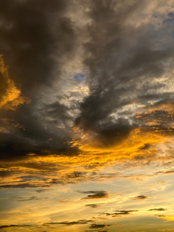 Storm clouds and sunset colors collide over Hoi An's coast