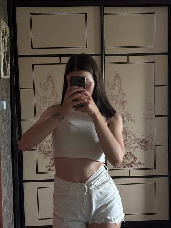 Mirror selfie session in a Vishnevka room, white outfit