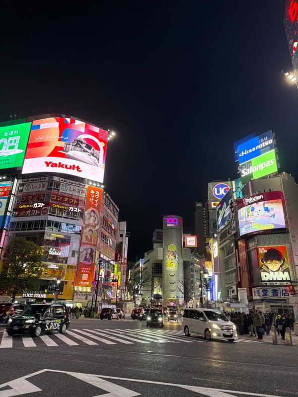 Night scene documented at Tokyo's busy Shibuya intersection