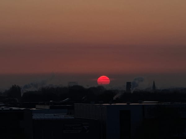 Red sunrise captured over Maasdijk Netherlands skyline