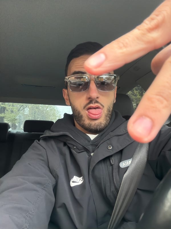 Man makes playful gestures in car near Plovdiv market
