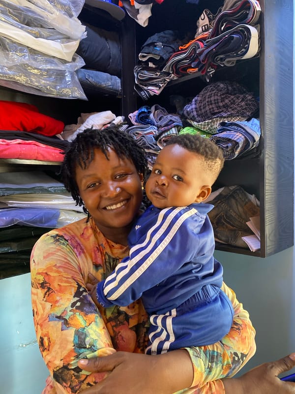 Woman and toddler photographed in domestic moment in Bukuru