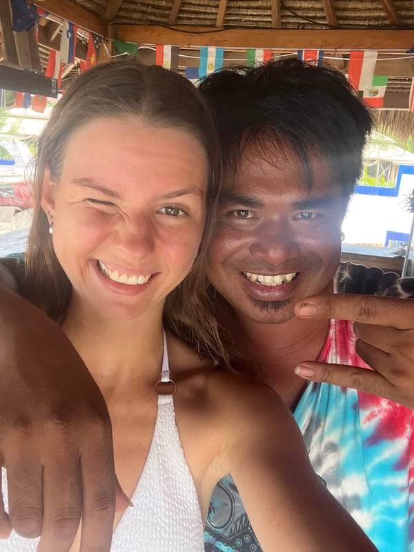Tourists take selfies at flag-decorated Indonesian shelter