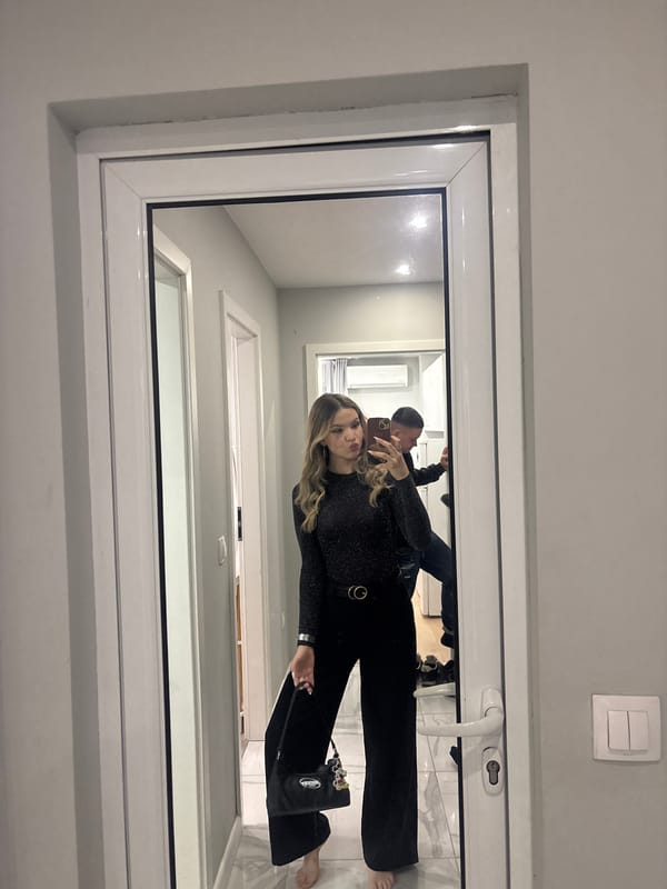 Woman takes mirror selfie in Velingrad bathroom