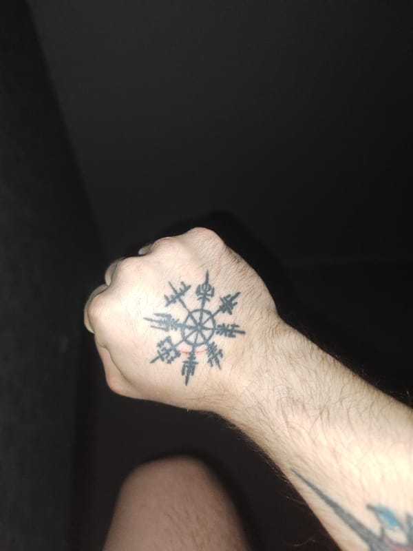 Tattooed person spotted in nighttime Hrodna street scene