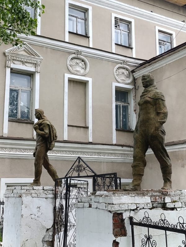 Weathered statues observed on crumbling base in Tara, Russia