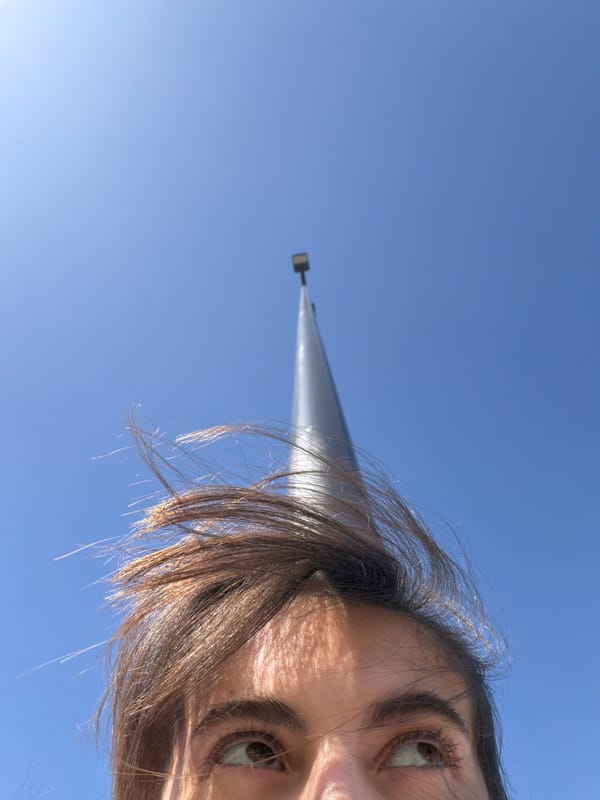 Person photographed from below against clear sky in Mascouche