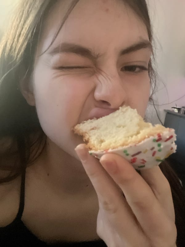Woman enjoys colorful sprinkled dessert in Saint Petersburg