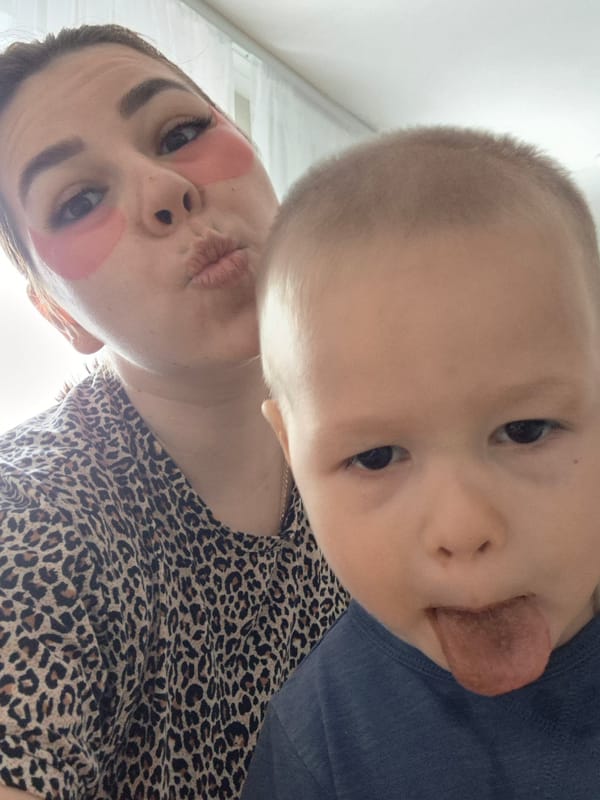 Mother and child skincare selfie session in Tobolsk home