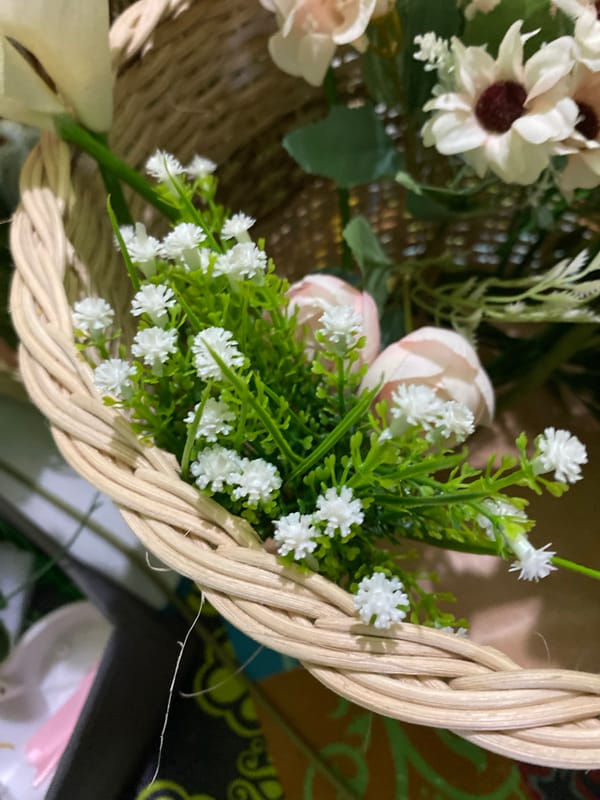 Artificial floral basket arrangements photographed up close in Kuala Pembuang