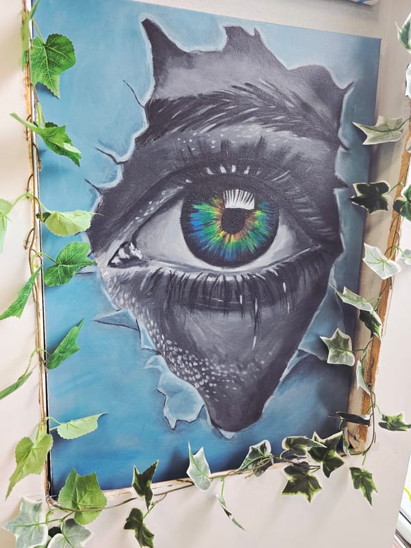 Framed eye painting with rainbow iris observed in Bulgaria