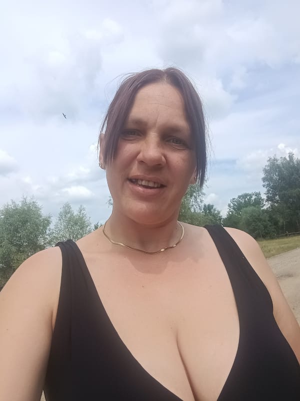 Swans at a pond and a selfie on a cloudy day in Litynia