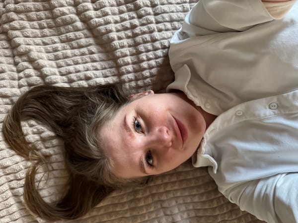 Woman photographed on bed in Gornyi, Russia