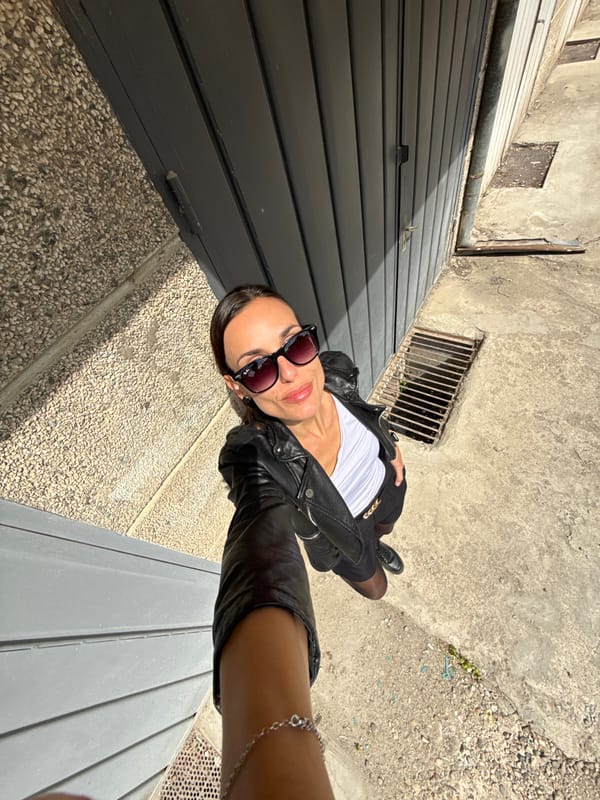 Woman takes sunny selfie on ground in Pleven