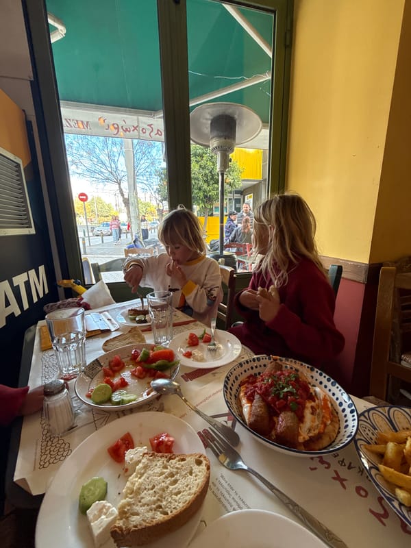 Children dine at Athens restaurant table